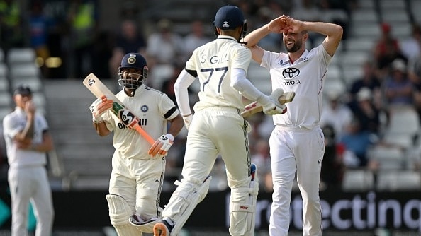 68639c7fe39fb-chris-woakes-of-england-reacts-as-rishabh-pant-and-shubman-gill-of-india-run-between-t.jpeg